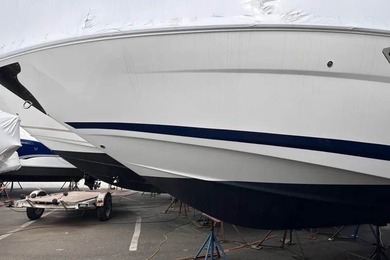 Slide: The Image of 2016 Regal 35 Sport Coupe boat on trailer in storage yard. - 19