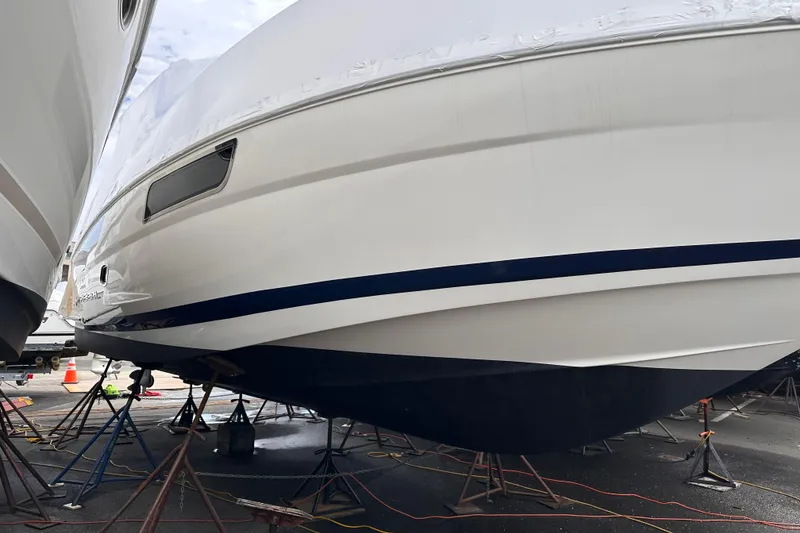 Slide: The Image of 2016 Regal 35 Sport Coupe yacht on stands, covered and ready for maintenance. - 20