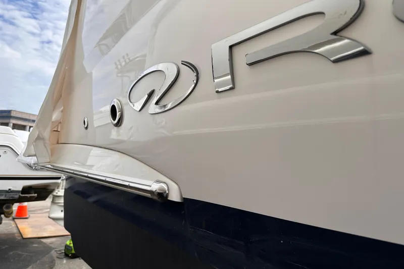 Slide: The Image of 2016 Regal 35 Sport Coupe boat with sleek exterior design and chrome logo. - 21