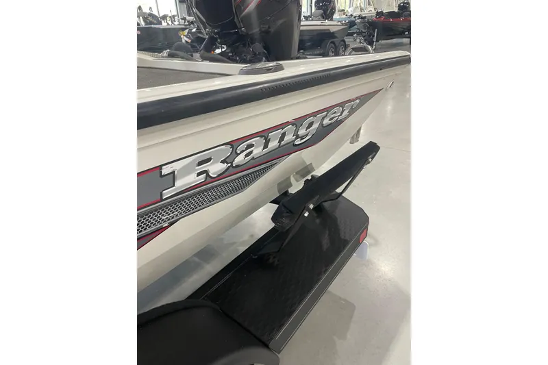 Slide: The Image of 2018 Ranger RT198P boat rear view with logo in showroom. - 2