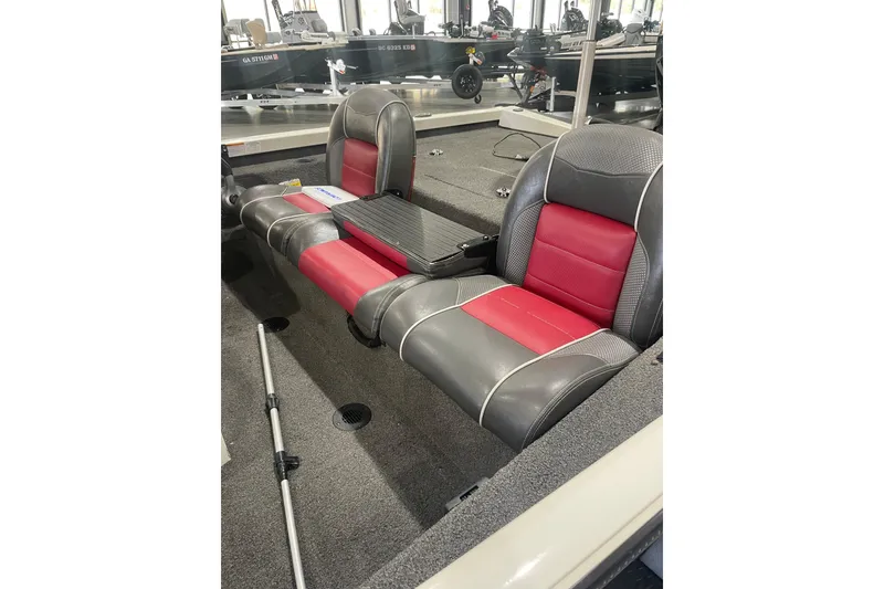 Slide: The Image of 2018 Ranger RT198P boat interior with red and gray seating, showroom display. - 7