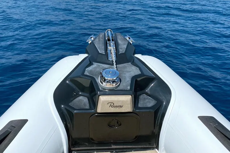 Slide: The Image of 2026 Ranieri Cayman 23.0 Sport boat on calm blue water. - 10