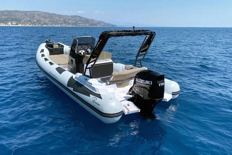 Slide: The Image of 2026 Ranieri Cayman 23.0 Sport boat on open sea with Suzuki engine. - 2