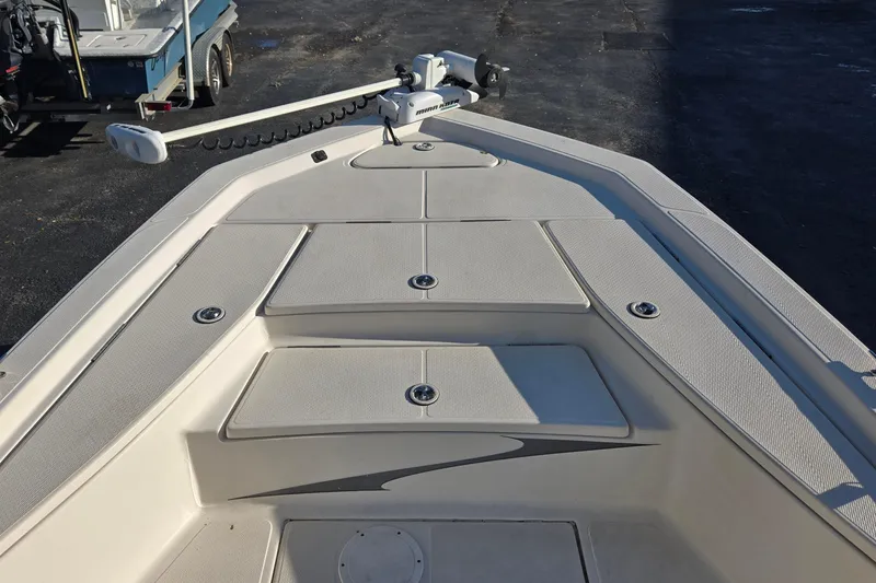 Slide: The Image of 2016 Blue Wave 1900 STL boat deck with storage compartments and trolling motor. - 11
