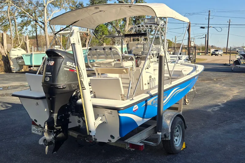 Slide: The Image of 2016 Blue Wave 1900 STL boat with Suzuki 140 outboard motor on trailer. - 3