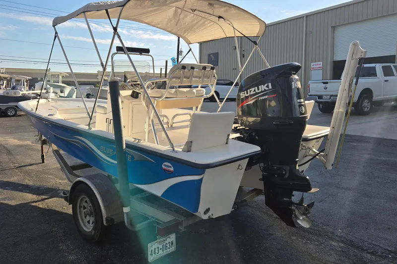Slide: The Image of 2016 Blue Wave 1900 STL boat with Suzuki outboard motor on trailer. - 5