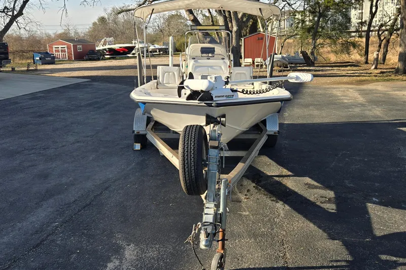 Slide: The Image of 2016 Blue Wave 1900 STL boat on trailer, parked outdoors. - 8