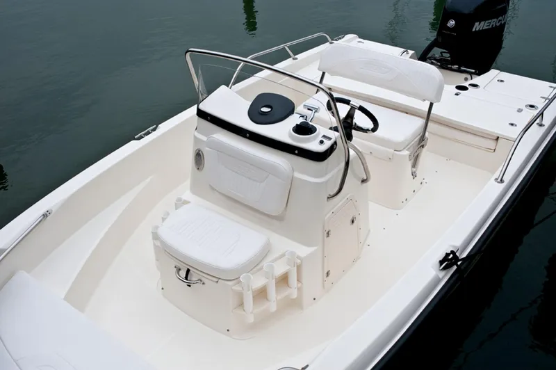 Slide: The Image of Manufacturer Provided Image: 2015 Boston Whaler 180 Dauntless boat interior with seating and console. - 13