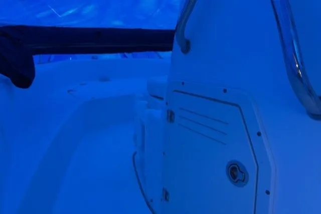 Slide: The Image of 2015 Boston Whaler 180 Dauntless boat interior with blue lighting. - 5