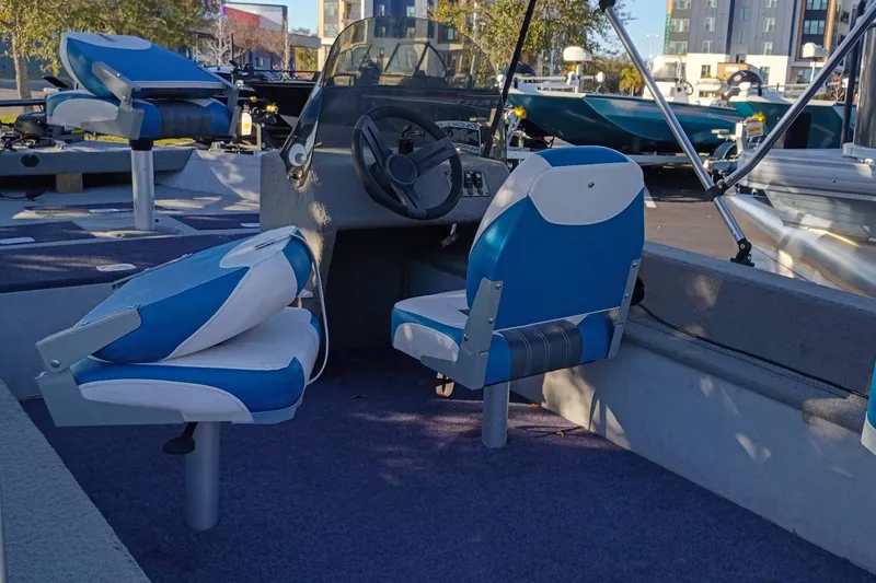Slide: The Image of 2009 Monark Vision 1601 SC boat interior with blue and white seating. - 4