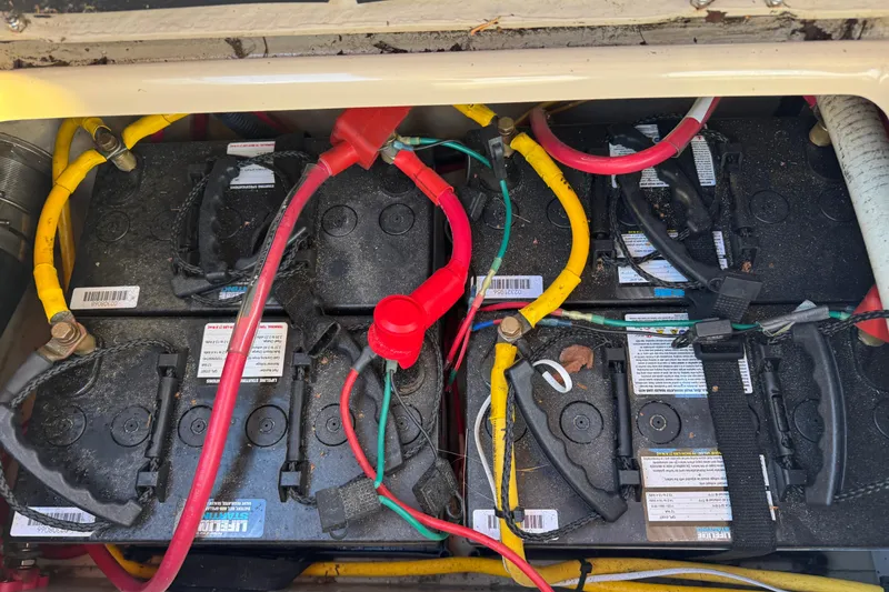 Slide: The Image of Battery compartment of 2010 Ranger Tugs R-25 SC with connected cables. - 10