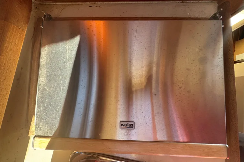 Slide: The Image of Stainless steel Wallas stove cover on 2010 Ranger Tugs R-25 SC boat. - 8