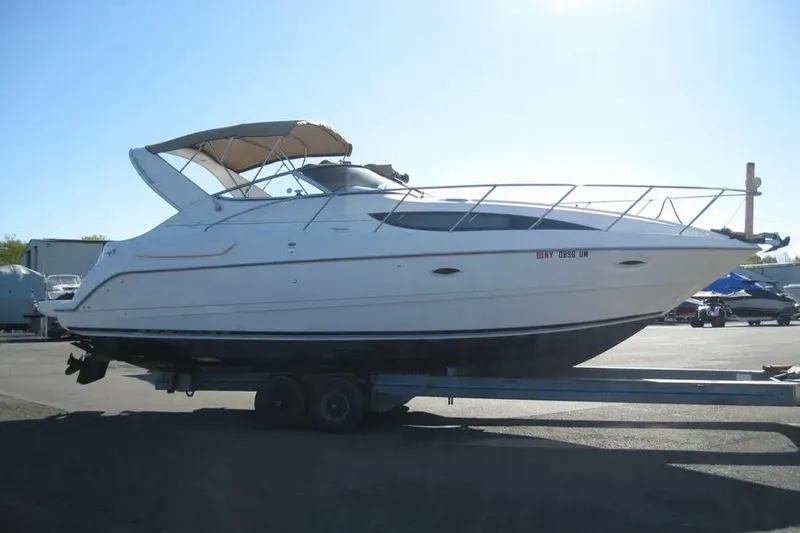 The Image of 2000 Bayliner 3055 Ciera Sunbridge DX/LX boat on trailer, side view. - 0