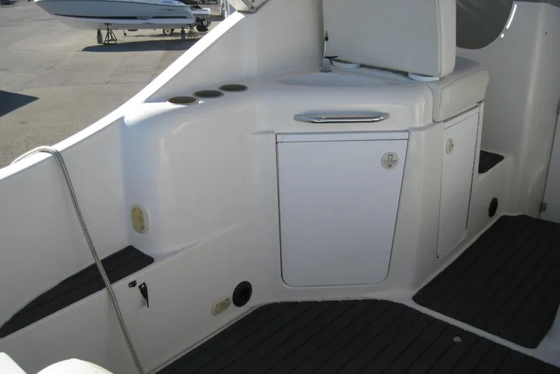 Slide: The Image of 2000 Bayliner 3055 Ciera Sunbridge DX/LX boat interior with seating and storage compartments. - 10