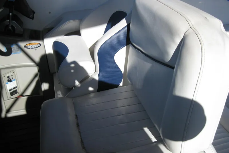 Slide: The Image of 2000 Bayliner 3055 Ciera Sunbridge DX/LX boat interior with white and blue seating. - 13
