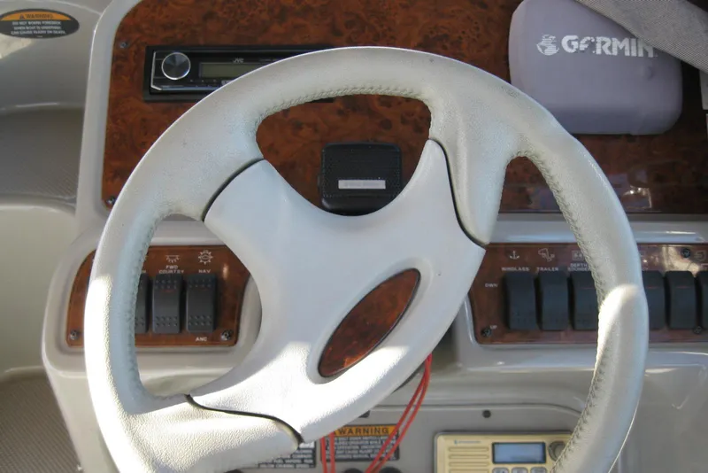 Slide: The Image of Steering wheel of 2000 Bayliner 3055 Ciera Sunbridge DX/LX with control panel. - 15