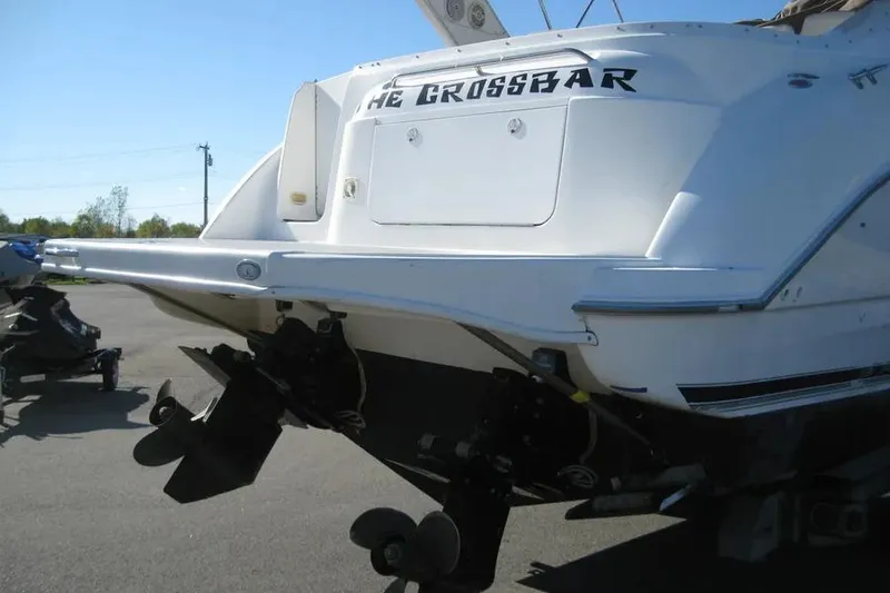 Slide: The Image of 2000 Bayliner 3055 Ciera Sunbridge DX/LX boat rear view with dual propellers. - 28