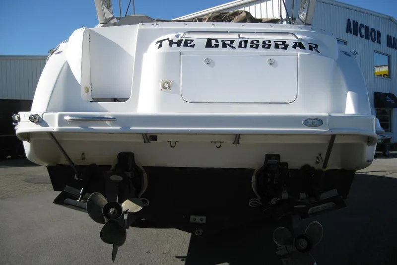 Slide: The Image of Rear view of 2000 Bayliner 3055 Ciera Sunbridge DX/LX boat with dual propellers. - 3
