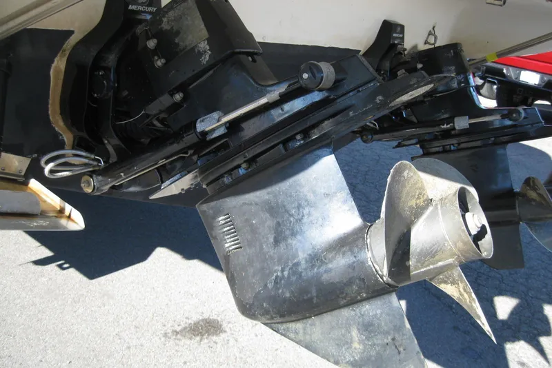 Slide: The Image of Close-up of a 2000 Bayliner 3055 Ciera Sunbridge DX/LX boat propeller and outdrive. - 4