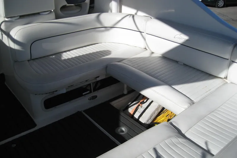 Slide: The Image of 2000 Bayliner 3055 Ciera Sunbridge DX/LX interior seating with white upholstery. - 9