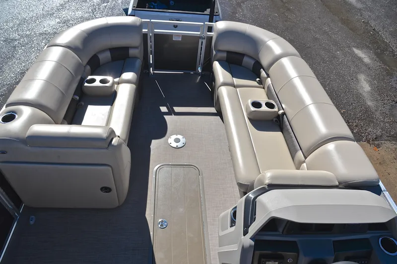 Slide: The Image of 2024 Sun Tracker Party Barge 22 XP3 interior with plush seating and cup holders. - 22