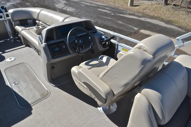 Slide: The Image of 2024 Sun Tracker Party Barge 22 XP3 interior with steering console and seating. - 26