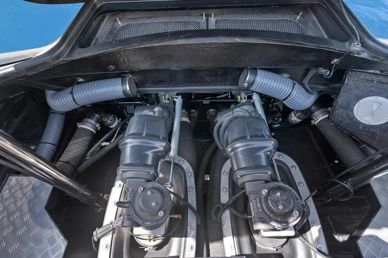 Slide: The Image of Engine compartment of a 2020 Princess R35 yacht, showcasing dual engines and ventilation hoses. - 31