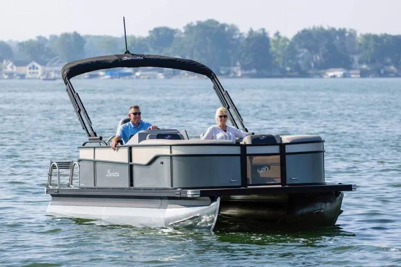 Slide: The Image of Manufacturer Provided Image: 2026 Barletta Aria 20L pontoon boat cruising on a serene lake. - 8