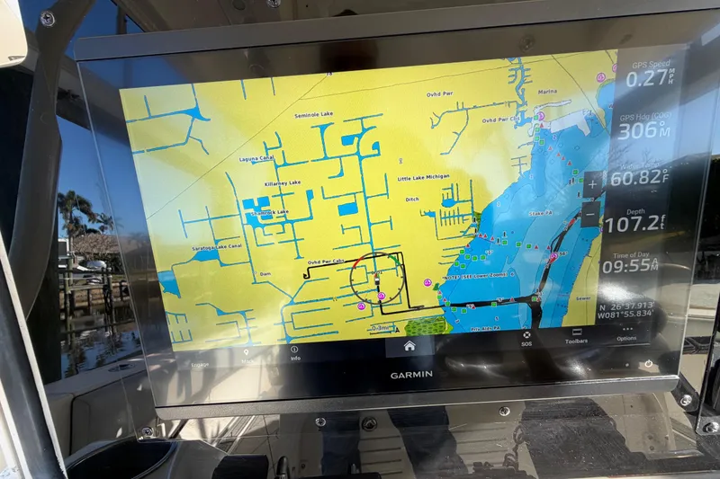 Slide: The Image of Garmin navigation display on 2016 Cobia 344 Center Console boat, showing lake map and data. - 18