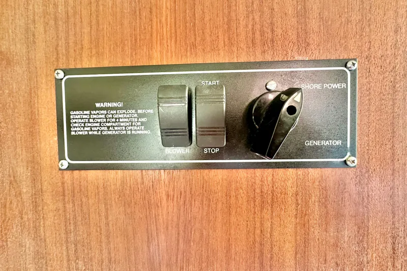 Slide: The Image of Control panel on 2004 Pursuit 3070 Offshore boat with blower and generator switches. - 95