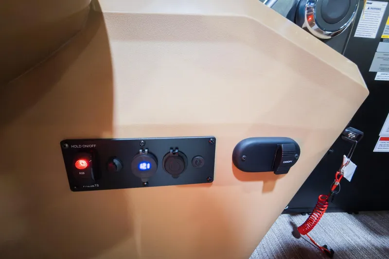 Slide: The Image of Control panel of 2026 Godfrey Sweetwater 22' Tritoon with switches and indicators. - 10