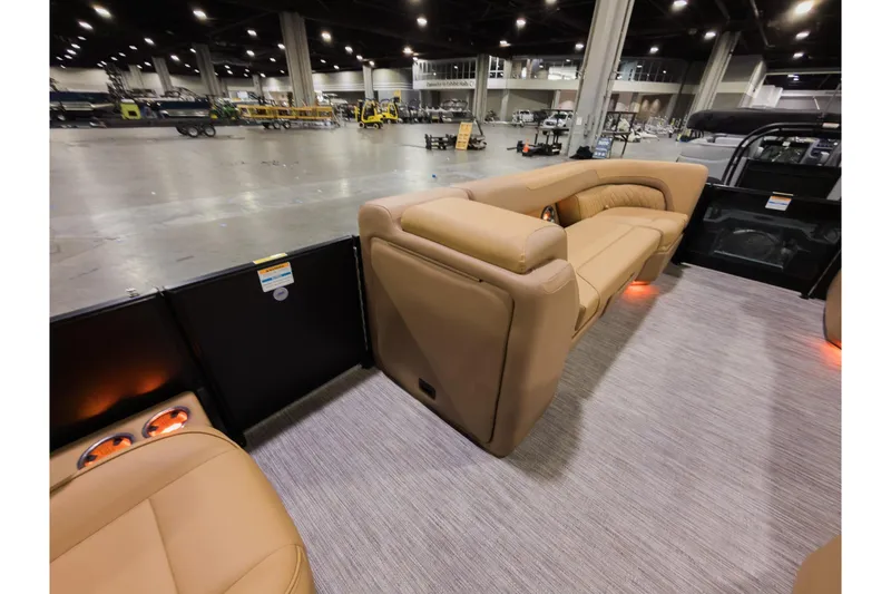 Slide: The Image of Luxurious interior of 2026 Godfrey Sweetwater 22' Split Bench Tritoon at a boat show. - 14