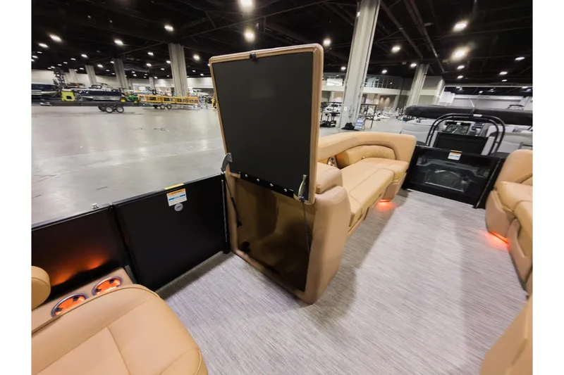 Slide: The Image of 2026 Godfrey Sweetwater 22' Tritoon interior with tan seating and modern design. - 15