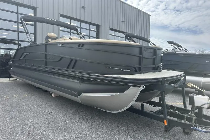 Slide: The Image of 2026 Evotti 723CS pontoon boat on trailer, parked outside dealership. - 11