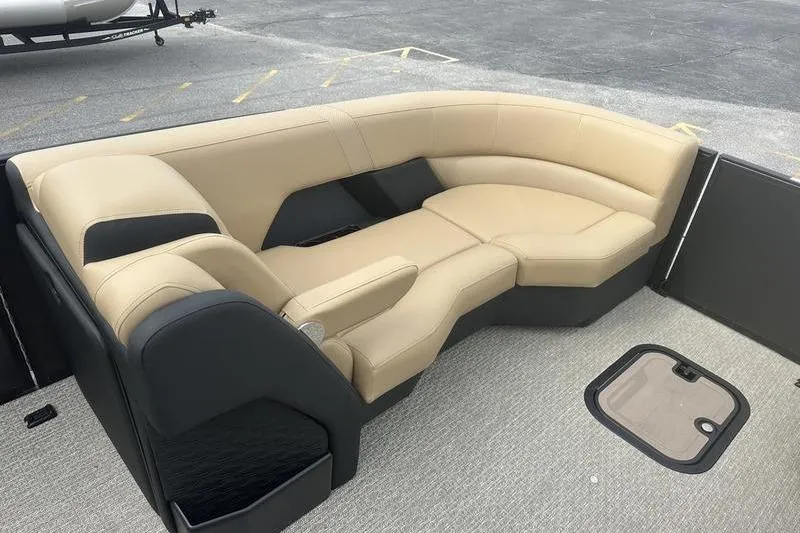 Slide: The Image of Luxurious seating on 2026 Evotti 723CS boat, featuring beige and black upholstery. - 13