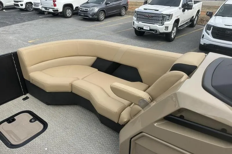Slide: The Image of Luxurious beige seating on 2026 Evotti 723CS boat, parked in a lot with vehicles. - 16