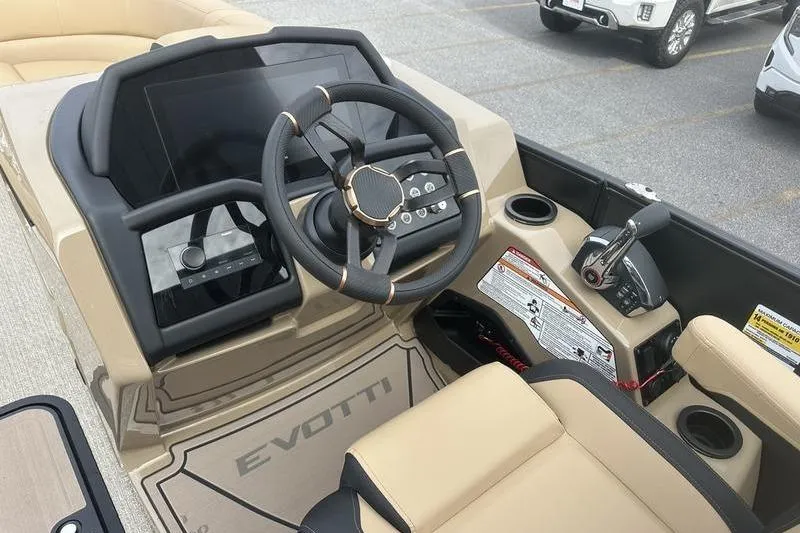 Slide: The Image of Evotti 723CS 2026 boat dashboard with steering wheel and control panel. - 19