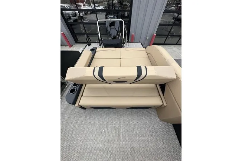 Slide: The Image of Luxurious seating on 2026 Evotti 723CS boat, featuring beige upholstery and cup holders. - 24