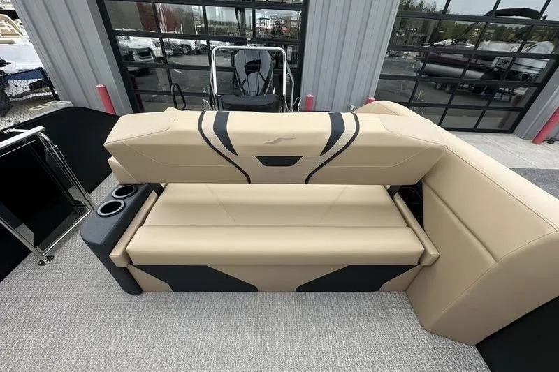 Slide: The Image of Beige and black seating on 2026 Evotti 723CS boat, featuring cup holders and modern design. - 25