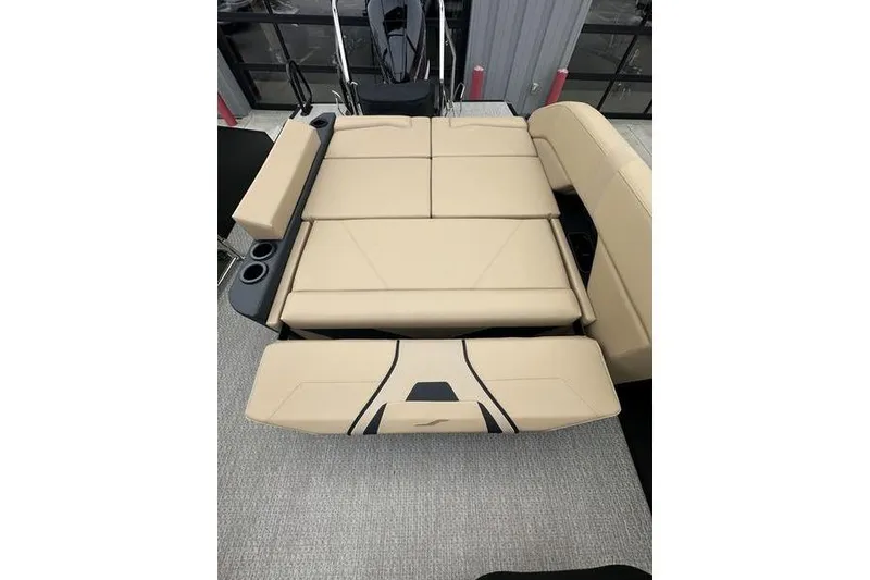 Slide: The Image of 2026 Evotti 723CS boat interior with beige convertible seating and cup holders. - 26