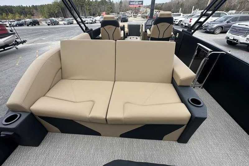 Slide: The Image of Luxurious seating on 2026 Evotti 723CS boat, featuring beige upholstery and cup holders. - 27