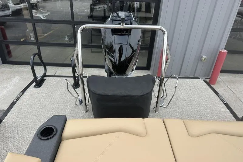 Slide: The Image of 2026 Evotti 723CS boat interior with engine, beige seating, and stainless steel railings. - 28