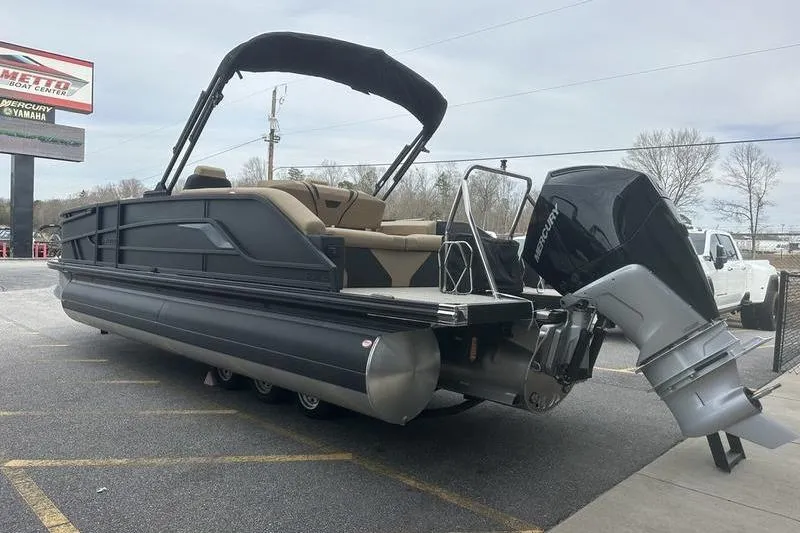Slide: The Image of 2026 Evotti 723CS pontoon boat with outboard motor in parking lot. - 6