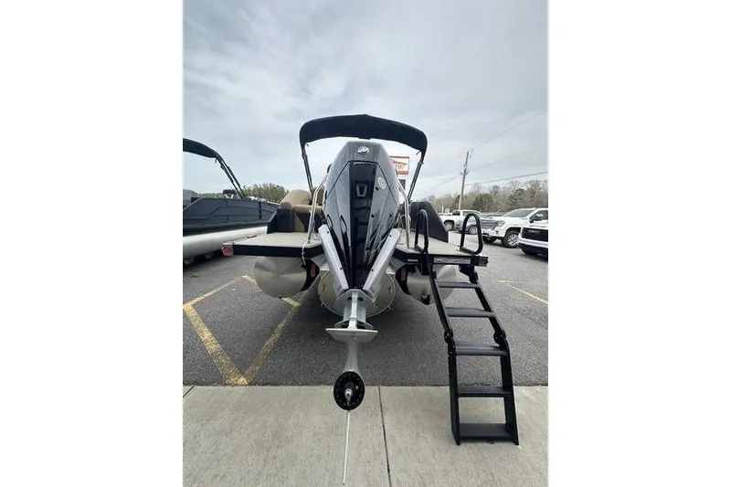 Slide: The Image of 2026 Evotti 723CS boat with ladder, parked outdoors on a cloudy day. - 8