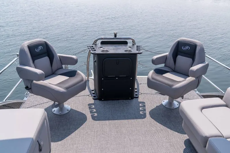 Slide: The Image of Manufacturer Provided Image: 2026 Barletta ARIA 20CC boat interior with plush seating and table on calm water. - 3