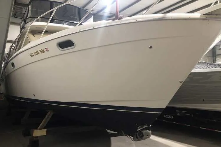 Slide: The Image of 1997 Bayliner 3988 Motoryacht in storage, showcasing sleek design and sturdy build. - 10