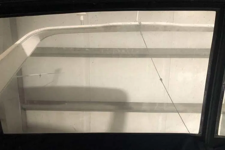 Slide: The Image of 1997 Bayliner 3988 Motoryacht window view, showcasing interior structure and design elements. - 17