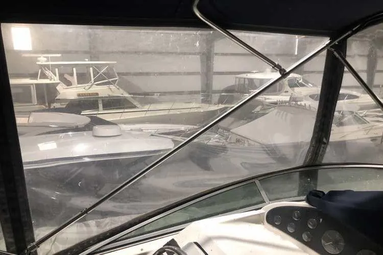 Slide: The Image of 1997 Bayliner 3988 Motoryacht in storage, surrounded by other boats. - 19