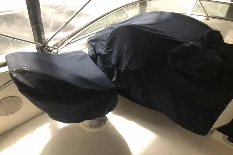 Slide: The Image of 1997 Bayliner 3988 Motoryacht helm covered with protective fabric. - 20