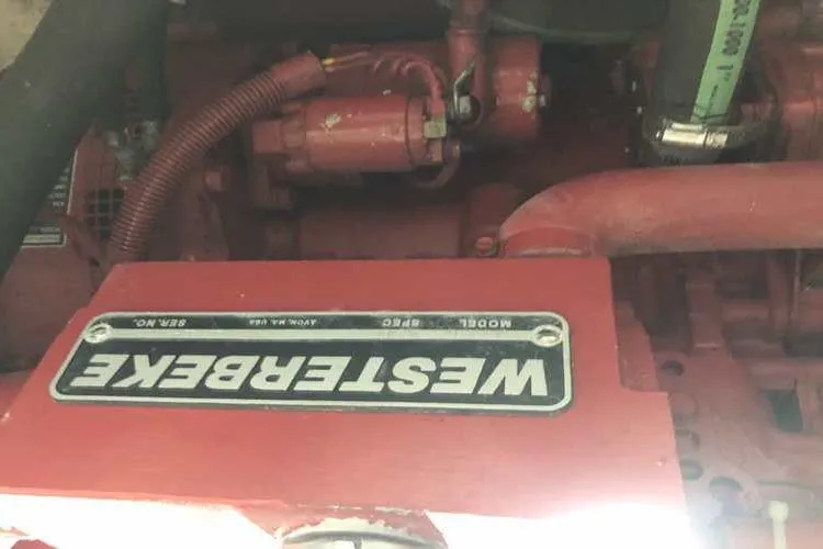 Slide: The Image of Engine compartment of 1997 Bayliner 3988 Motoryacht featuring Westerbeke generator. - 26